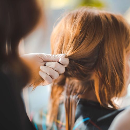 hairdresser-styles-woman-s-hair-in-a-salon-2026-03-24-21-59-11-utc